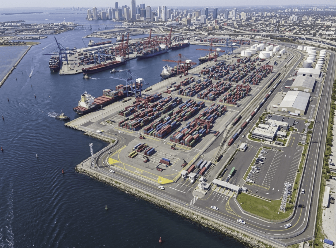 Aerial view of commercial seaport and city waterfront.